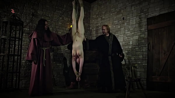 Mooin Witch – The exhausted milkmaid is pulled upside down to the ceiling with weights at her wrists  to be tormented and interrogated further and to see milk flowing (preview)